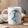 White mug with Lake Coeur d'Alene map graphic and compass.