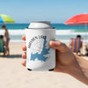 Can cooler with Hayden Lake Idaho map and compass design held on beach.