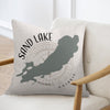 Pillow with Sand Lake Ontario map design and compass rose graphic.