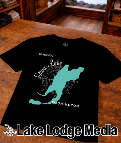 Black t-shirt with "Snow Lake" map and compass, and "Lake Lodge Media" logo.