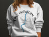White sweatshirt with Lake Okanagan map and compass graphic, British Columbia.