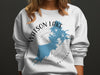 White sweatshirt with a blue Watson Lake, Arizona graphic and compass rose.