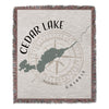 Woven blanket with Cedar Lake map and compass design, Ontario.