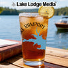 Iced tea in a glass with a blue lake map and compass design, "Rampart" text.