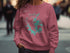 Pink sweatshirt with "Lake Martin ALABAMA" and compass rose graphic.
