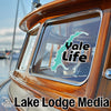 Logo sticker "Yale Life" on a boat window, "Lake Lodge Media" text below.