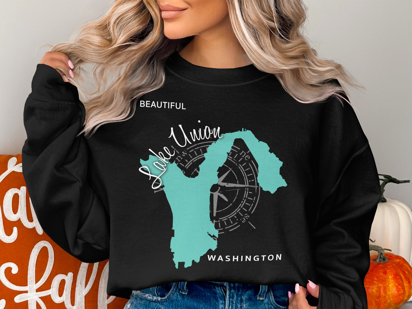 Black sweatshirt with "Beautiful Lake Union, Washington" text and compass graphic.