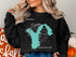 Black sweatshirt with "Beautiful Lake Union, Washington" text and compass graphic.