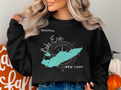 Black crewneck sweatshirt with turquoise Lake Erie map and compass graphic.