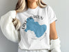 White t-shirt with blue Lake Calhoun map, Georgia text, and compass rose graphic.