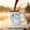 White mug with Stockton Lake Missouri map and compass, with coffee splashing.