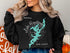 Black sweatshirt with a teal Lake Hopatcong map and compass graphic.