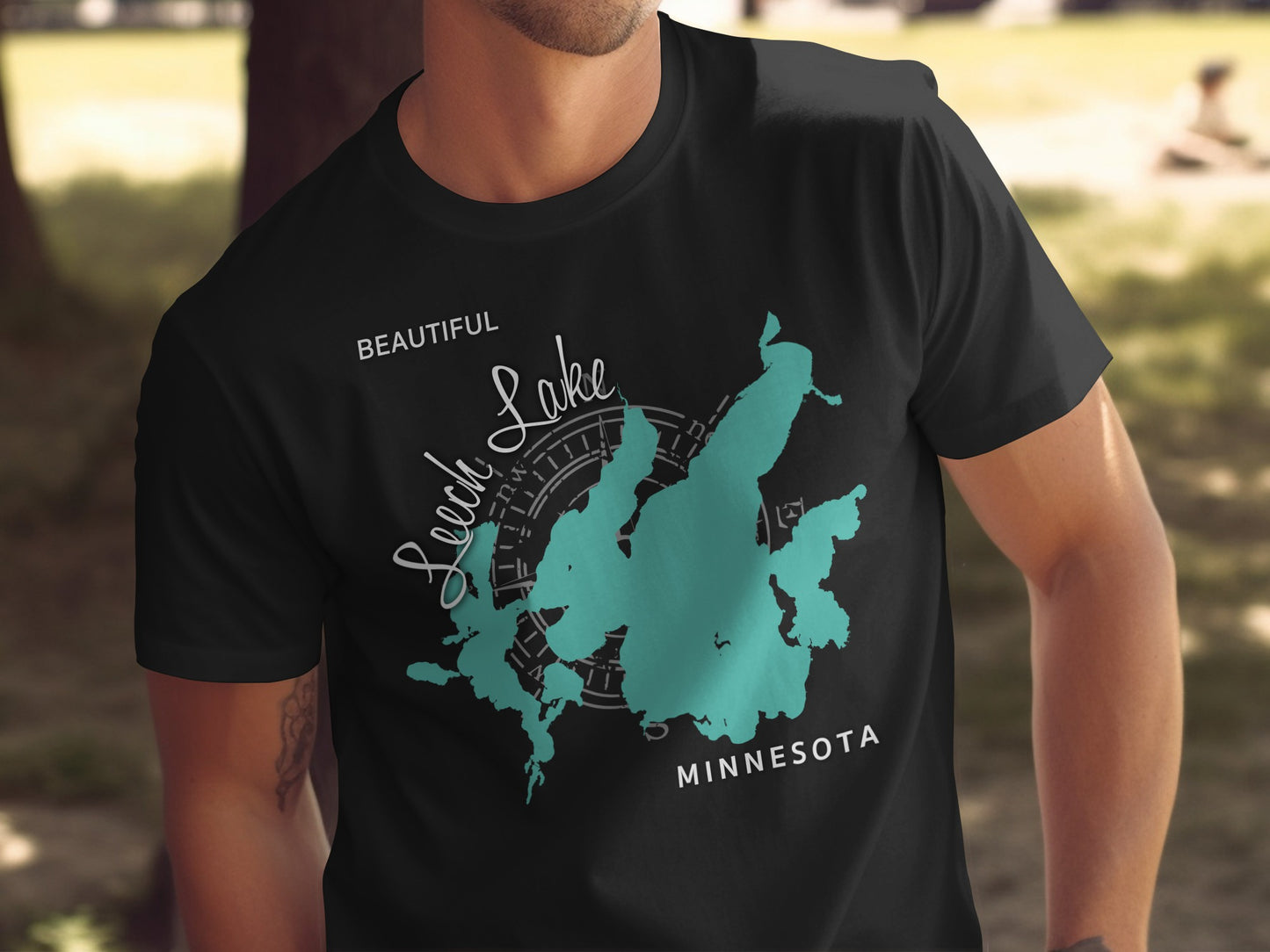 Black t-shirt with Leech Lake Minnesota map and compass graphic.