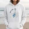 White hoodie with Balsam Lake Ontario map and compass graphic.