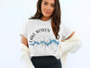White t-shirt with blue Lake Bowen map graphic and compass design.