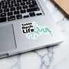 Sticker with "Table Rock Life" text and teal lake outline on a laptop.