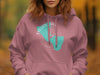 Pink hoodie with teal Sylvan Lake South Dakota map and compass design.
