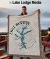 Lake Burton Georgia map design on a fringed throw blanket held by a man.