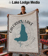 Woven blanket with teal Calcasieu Lake map and "Lake Lodge Media" logo.