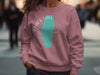 Rose crewneck sweatshirt with Black Lake Idaho graphic and compass rose.