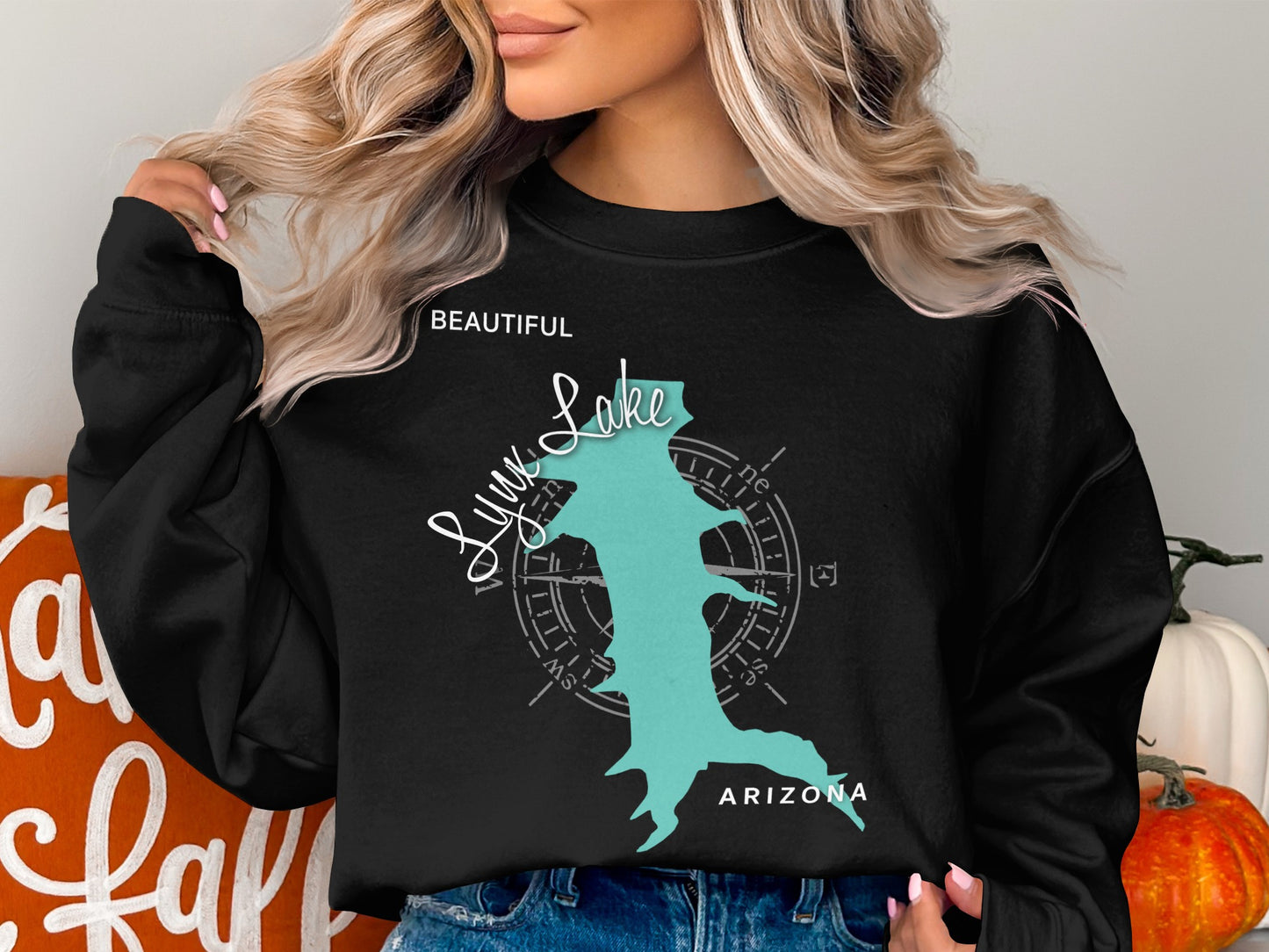Black sweatshirt with a teal Lynx Lake, Arizona map design and compass.