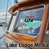 Harlan Life graphic and Lake Lodge Media logo on a boat window.