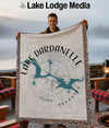Throw blanket with Lake Dardanelle map and compass design.