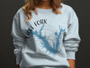 Lake Fork Texas map and compass design on light blue crew neck sweatshirt.