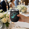 Black tumbler with custom lake map and compass design held by a hand.