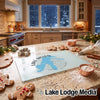 Tempered glass cutting board featuring a blue map graphic of Lake Dillon, Colorado, resting on a kitchen counter.