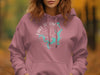 Pink hoodie with a teal Lake Texoma, Texas map and compass graphic.