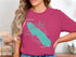 Onondaga Lake map graphic with compass rose and "New York" text on a pink t-shirt.