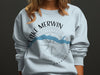 Light blue sweatshirt with Lake Merwin Washington compass graphic.