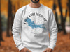 White sweatshirt with Lake Kabetogama, Minnesota map and compass graphic.