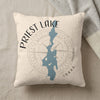 Cream pillow with blue Priest Lake map outline and compass rose graphic.