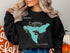 Black sweatshirt with Lake Cuyamaca map and compass rose graphic.