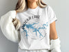 White t-shirt with 'Patoka Lake Indiana' and lake map over compass graphic.