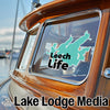 Turquoise Leech Life sticker on a boat window, with Lake Lodge Media text.