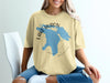 Yellow t-shirt with blue outline map of Lake Huron and "Michigan" text.