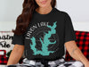 Black t-shirt with teal Lavon Lake map graphic and compass rose.