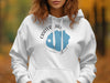 White hoodie with Crater Lake Oregon map design and compass rose graphic.