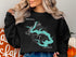 Black sweatshirt with Spoon Lake Illinois and compass graphic.