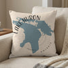 Light beige pillow with blue Lake Huron outline and text "LAKE HURON ONTARIO"