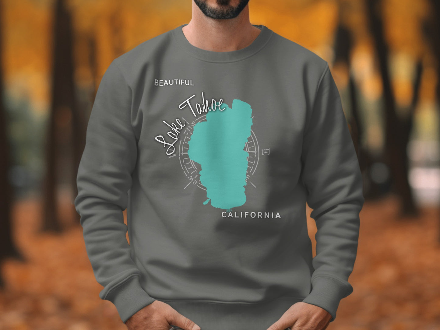 Dark grey sweatshirt with turquoise Lake Tahoe map and compass design.