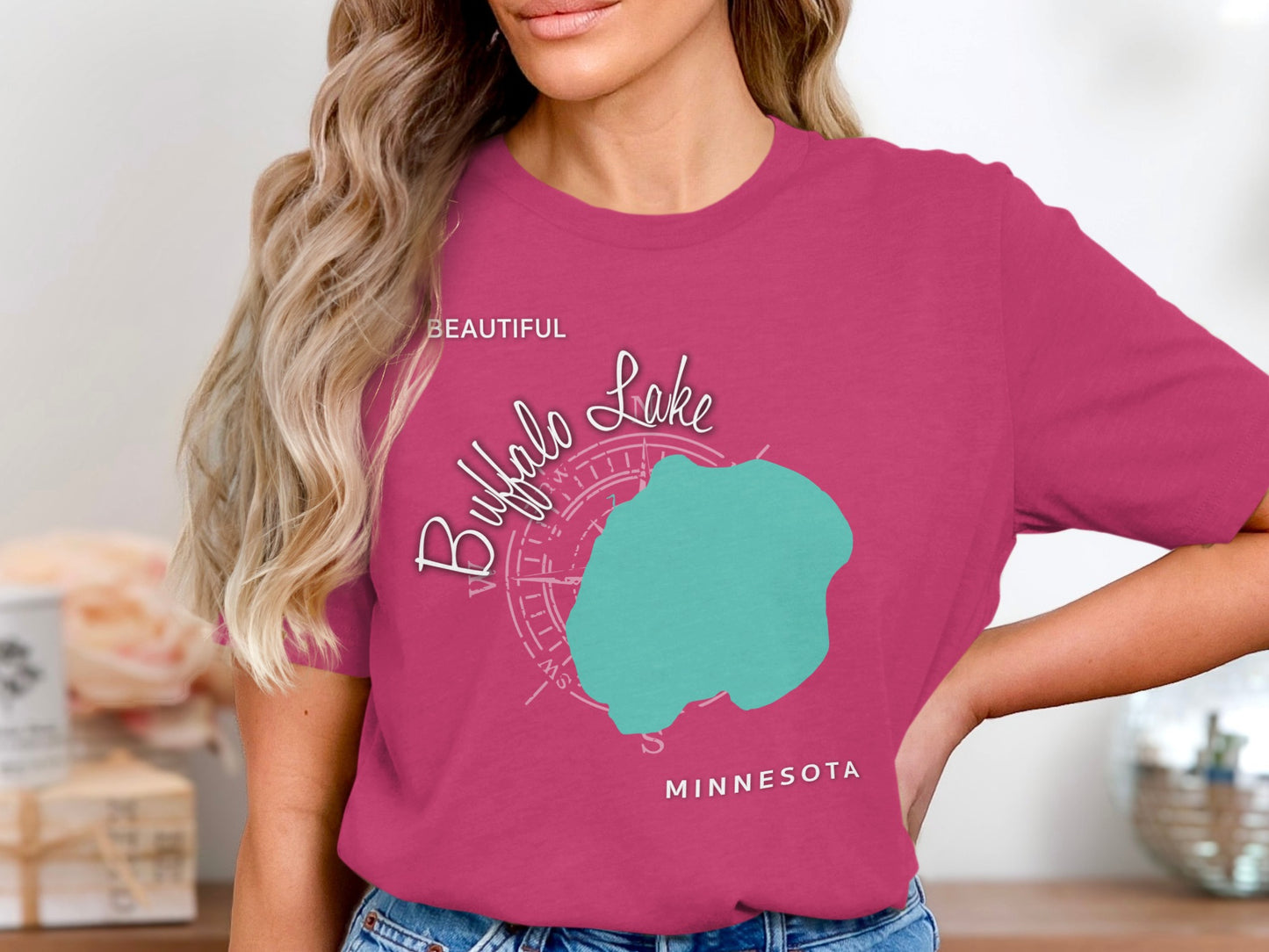 Pink t-shirt with a turquoise map of Buffalo Lake and compass design.