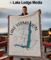 Fringed blanket with Lake Vermilion, Minnesota map and compass design.