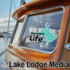 Turquoise Rampart Life sticker on a boat window, with Lake Lodge Media logos.