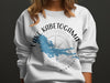 White sweatshirt with "Lake Kabetogama Minnesota" and lake map graphic.