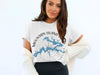 White t-shirt with blue Mountain Island Lake graphic and compass, 2037 Lake Lodge Media.