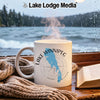 White mug with Lake Winnipeg Manitoba graphic and steam on a wooden table.